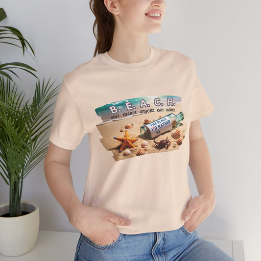 Person wearing a t-shirt with a beach-themed graphic design and a text B.E.A.C.H