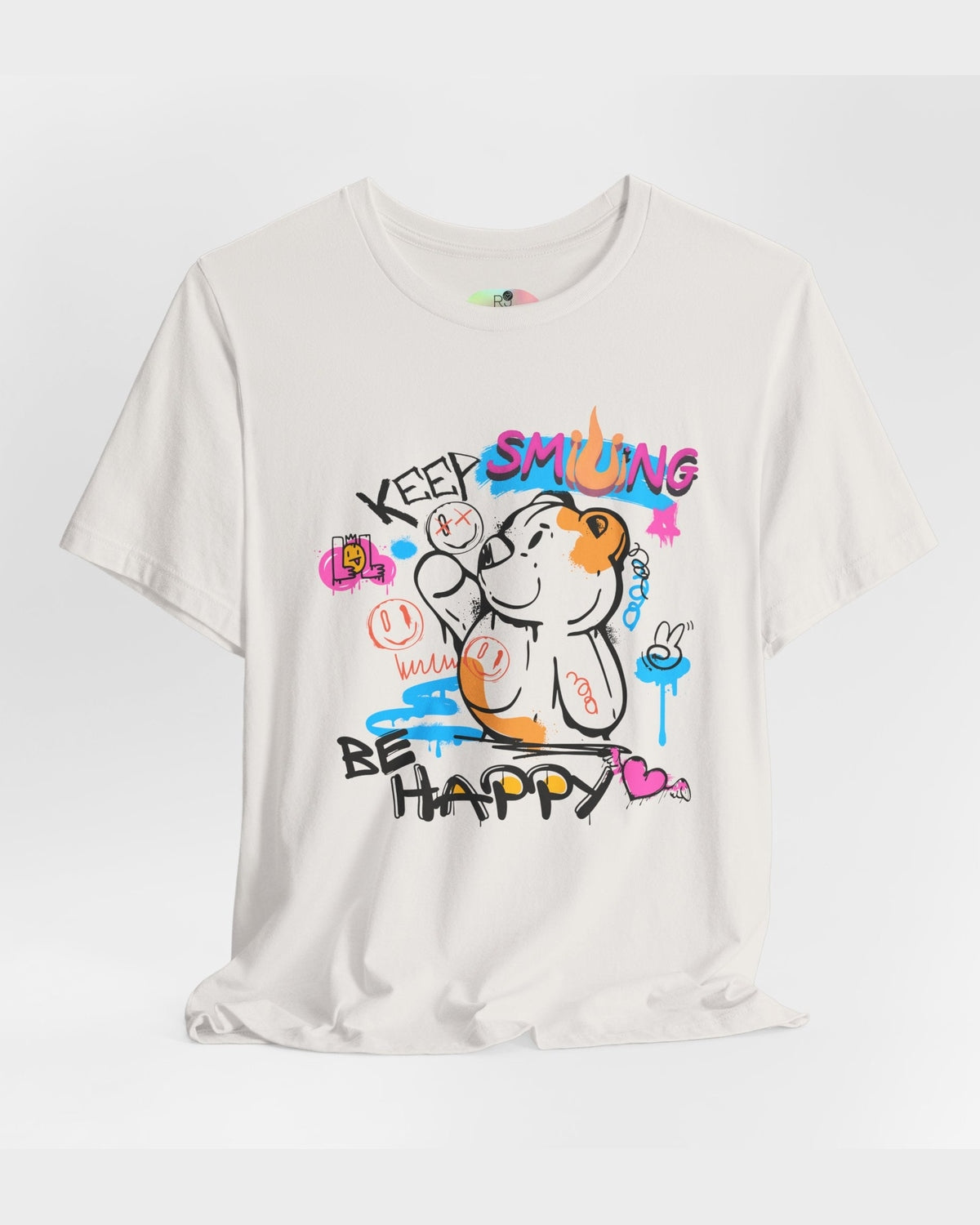 White t-shirt with colorful graphic design and text Keep Smiling Be happy on a light gray background