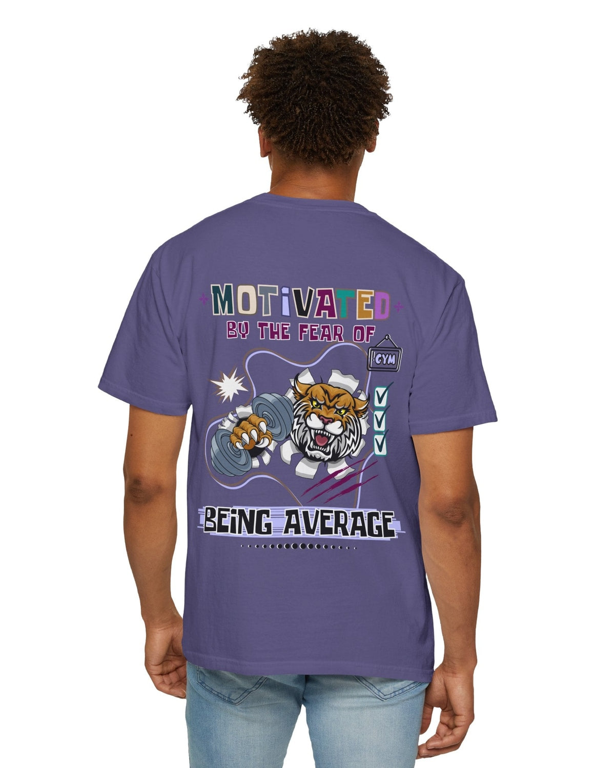 Person wearing a purple t-shirt with motivational text 'Motivated by the fear of being average' and tiger and gym graphics on the back.