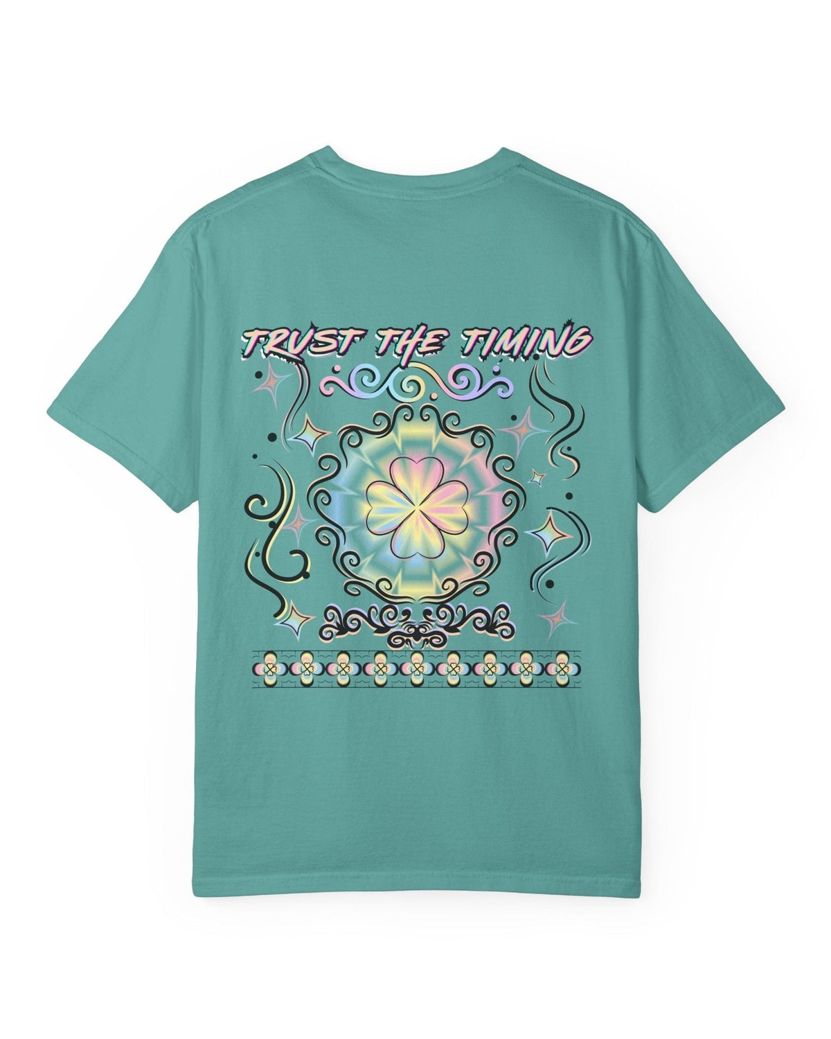 A green t-shirt with a colorful graphic four leaf clover design and a text trust the timing on a white background