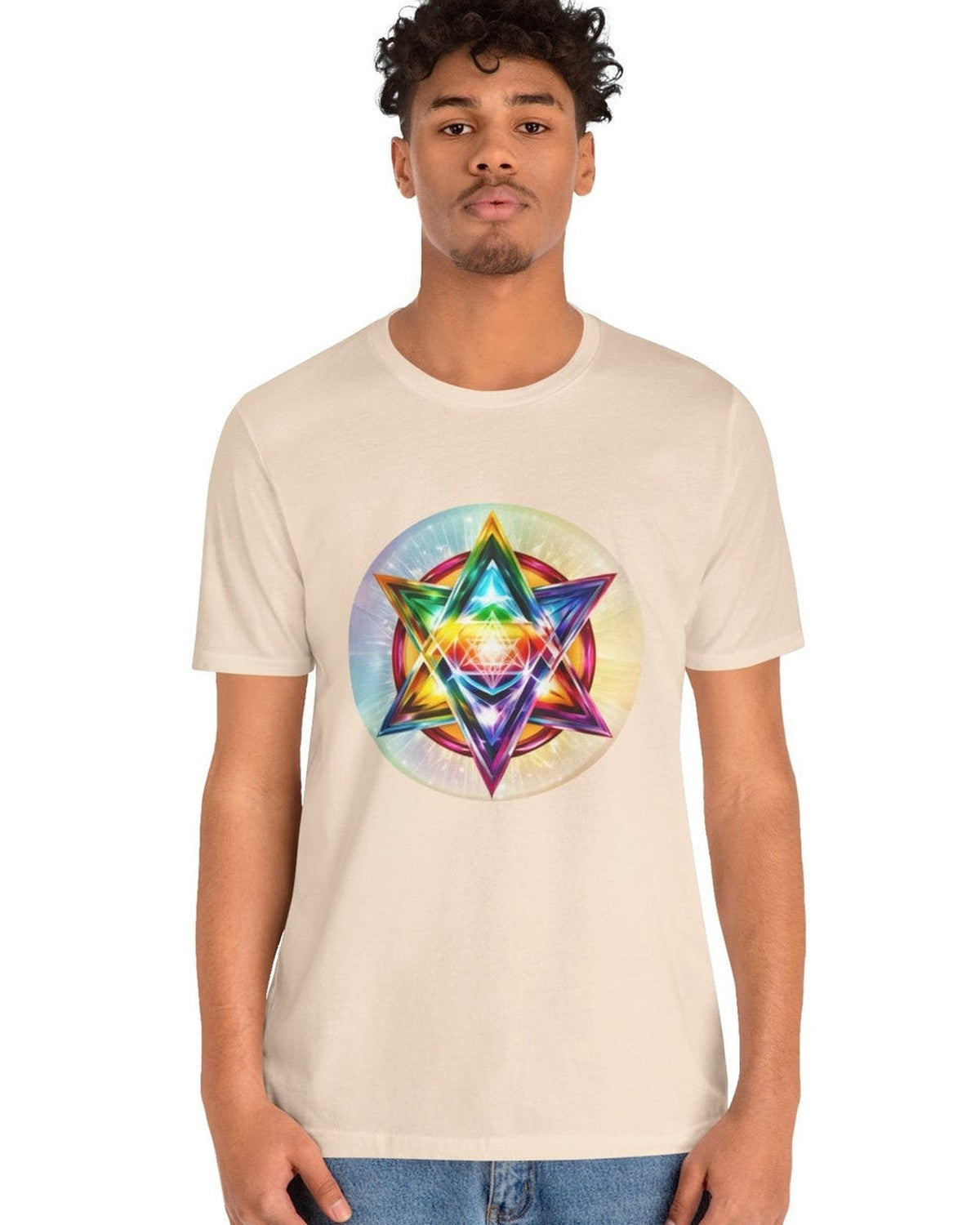 Person wearing a beige t-shirt with a colorful Merkaba design on a white background