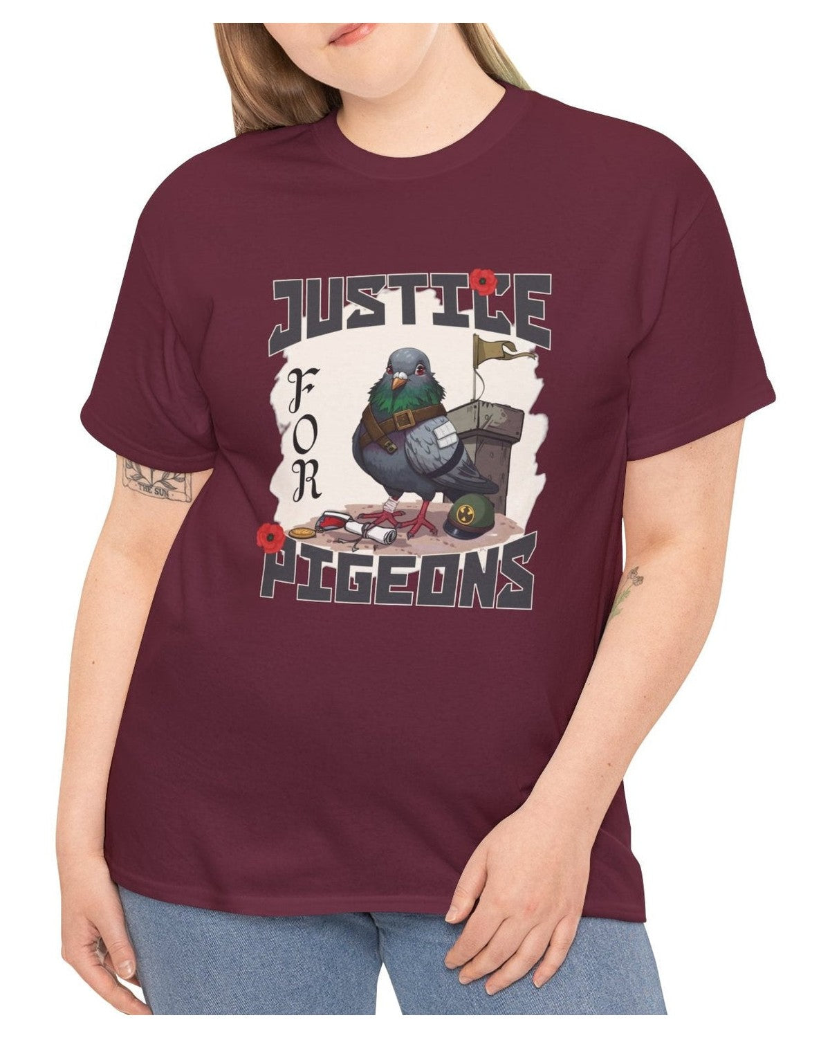 Maroon t-shirt with a graphic of a pigeon and text 'Justice for Pigeons' worn by a person.