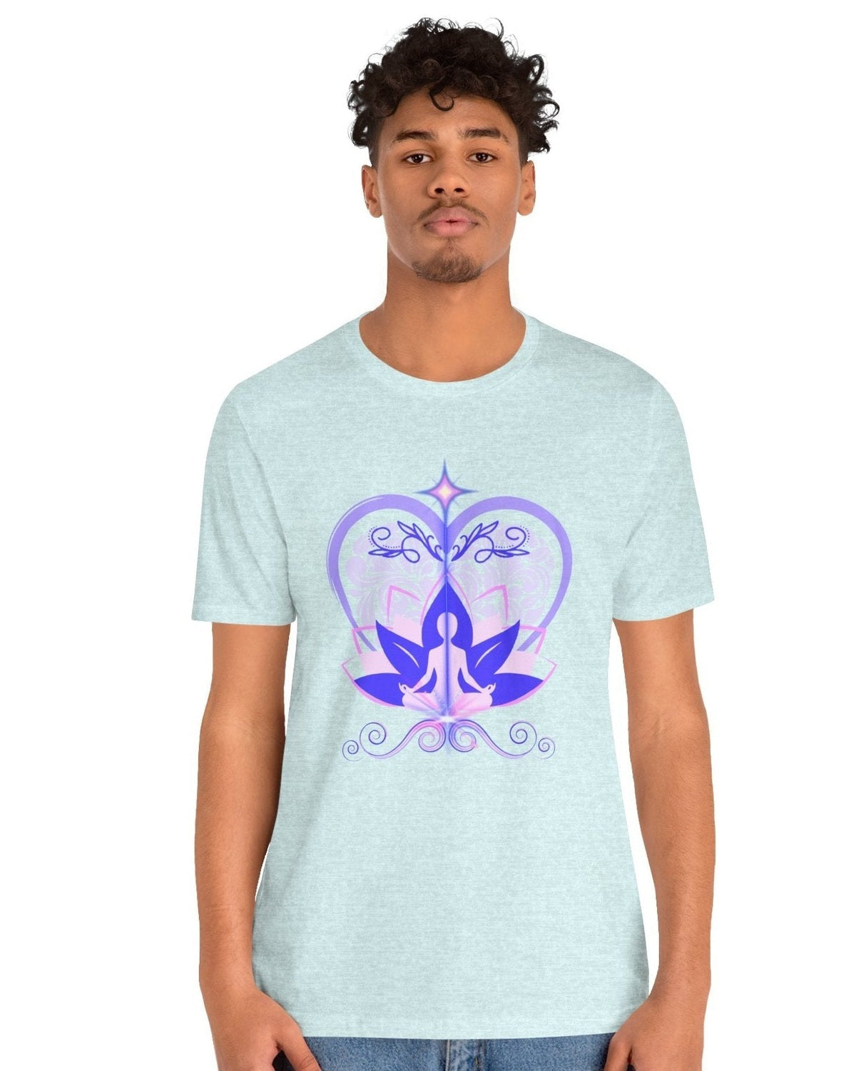 Person wearing a light blue t-shirt with a purple and pink design of a meditating figure, heart and lotus design on a white background