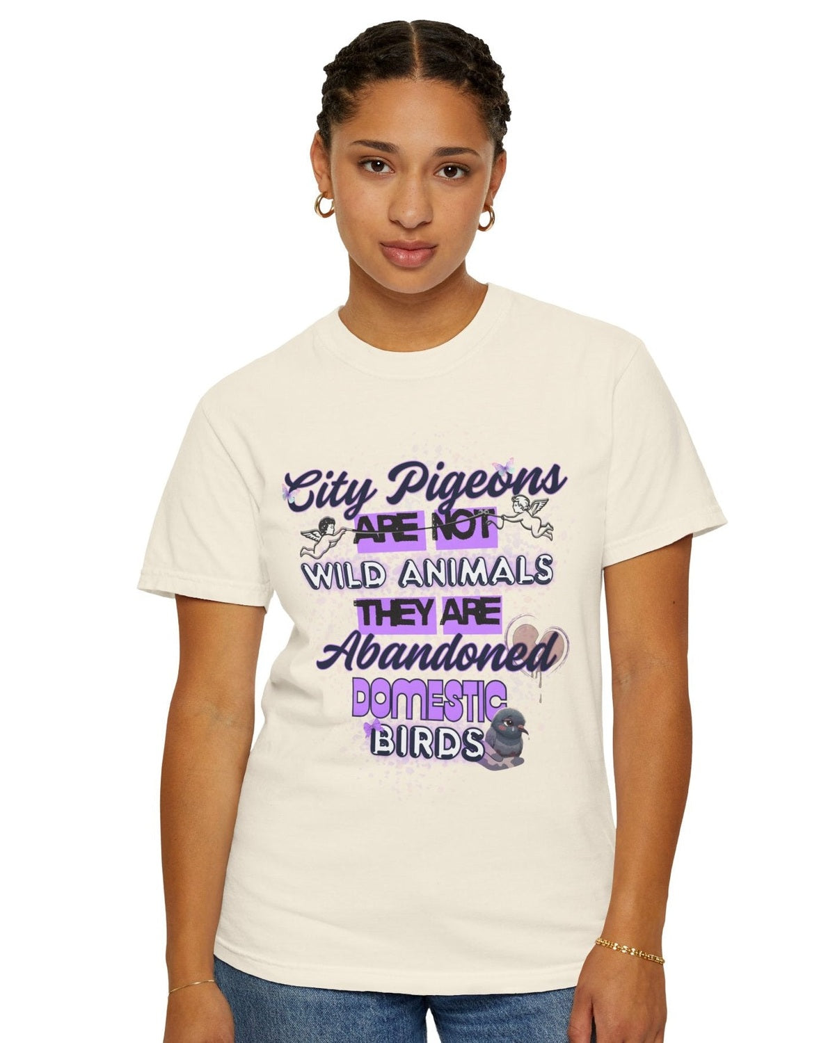 Person wearing a yellow t-shirt with a colorful graphic and text City Pigeons are not wild animals.