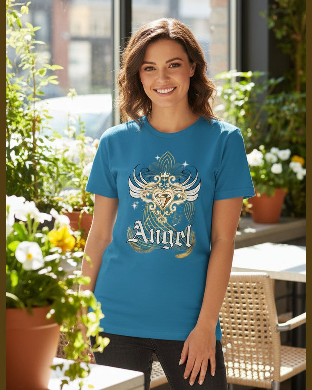 Female wearing Blue t-shirt with angel design and 'Angel' text at a coffee shop 