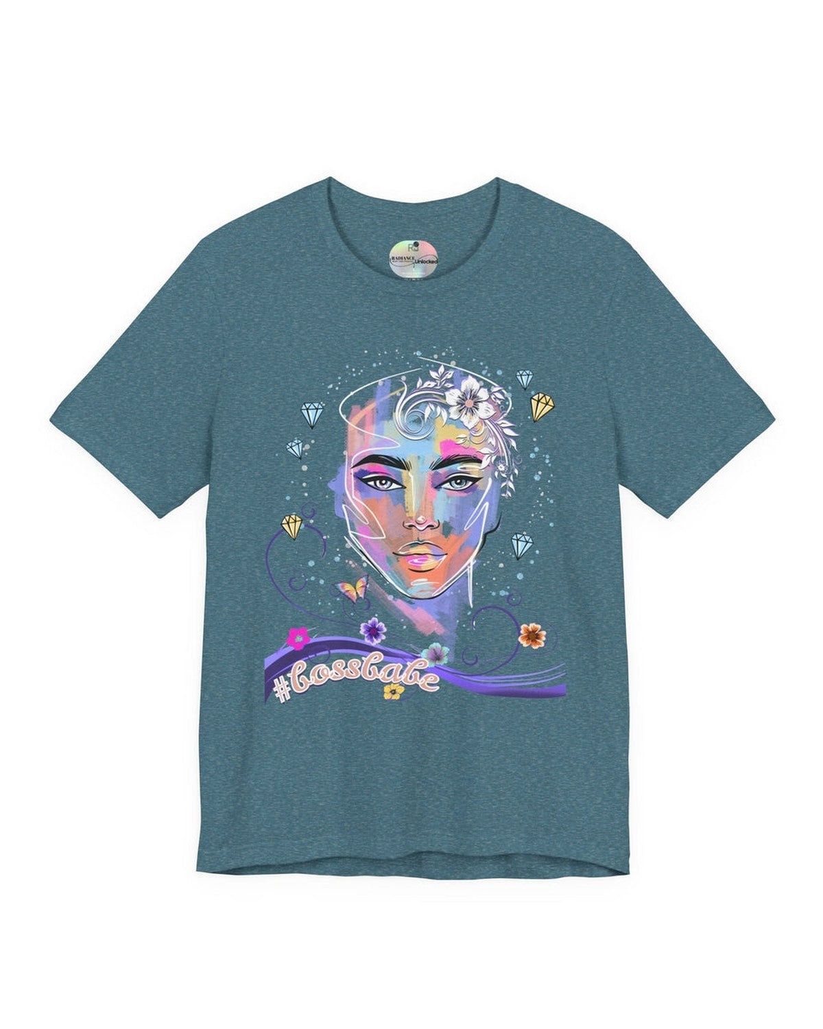 Teal t-shirt with a colorful graphic design of a female face, diamonds and flowers and a text #bossbabe on a white background