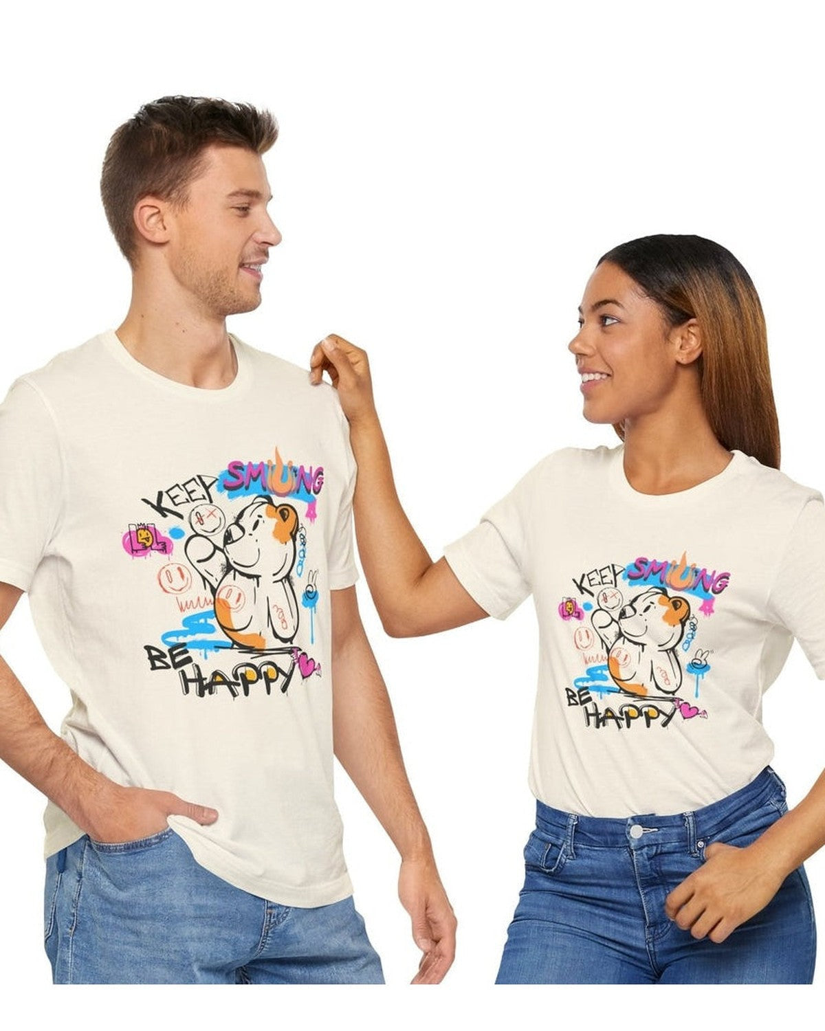Two people wearing matching t-shirts with a cartoon design and text Keep Smiling, Be Happy on a white background