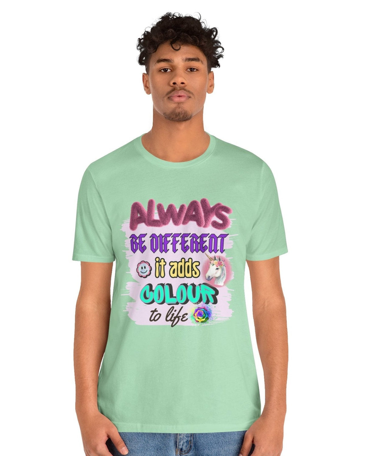 Person wearing a light green t-shirt with colorful text and graphics on a white background