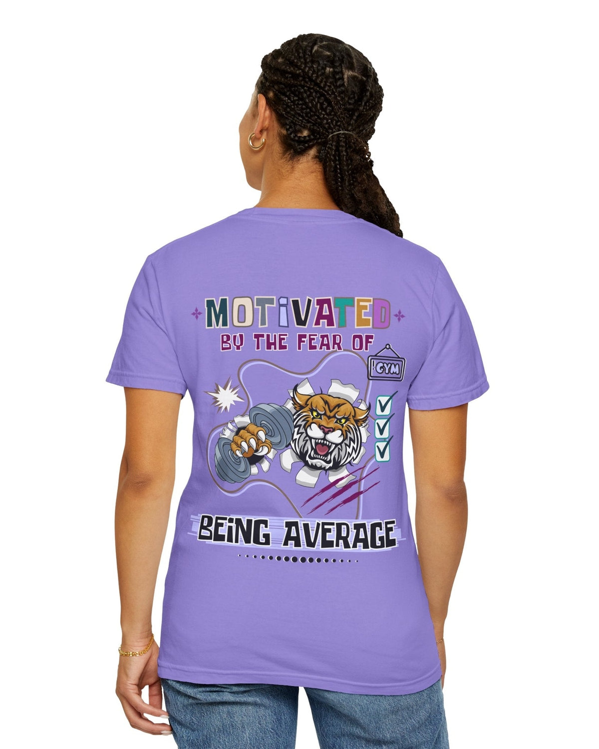 Person wearing a purple t-shirt with motivational text 'Motivated by the fear of being average' and gym graphics on the back.