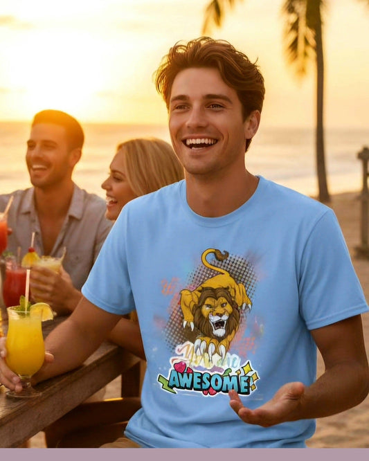 Man wearing a blue t-shirt with a lion graphic and 'You are Awesome' text at a beach sunset gathering.