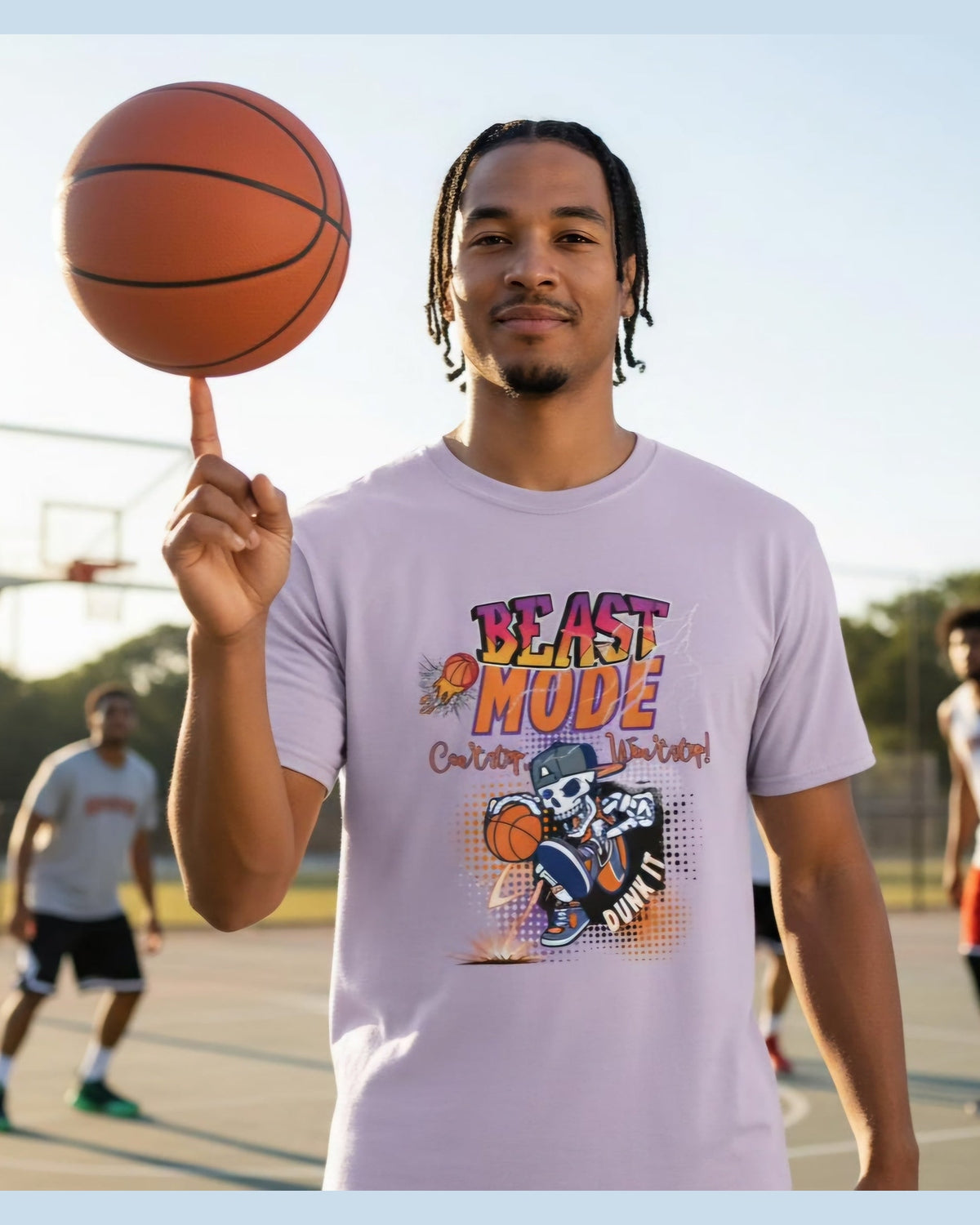 Man holding a basketball on a court wearing a purple Tshirt with a text a 'Beast Mode Cant Stop Wont Stop'.