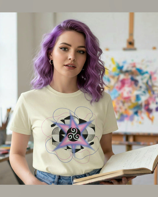 Person wearing a soft yellow t-shirt with a graphic design, sitting in a room with art supplies and a colorful painting.