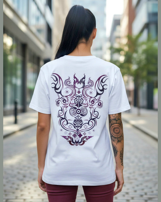 Person wearing a white t-shirt with a tatop inspired design on the back, standing in an urban setting.