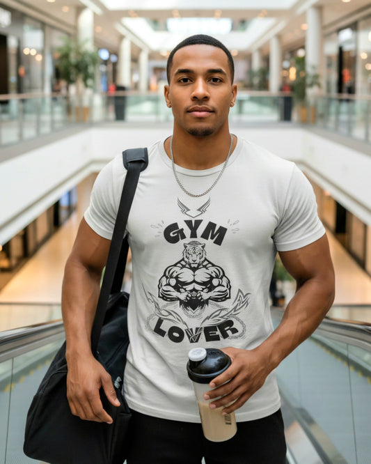 Man wearing a grey t-shirt with black graphic design featuring a muscular tiger and 'Gym Lover' in a mall