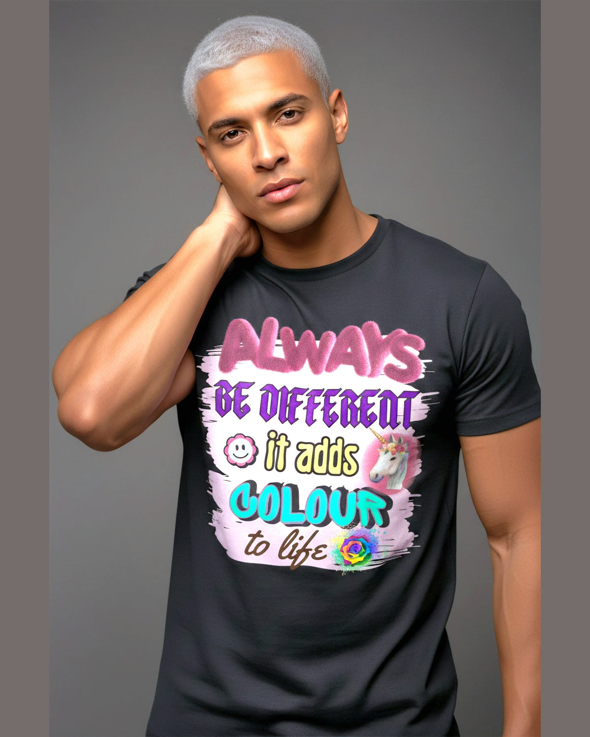 Man wearing a black t-shirt with colorful motivational text Always and Be Different on a gray background