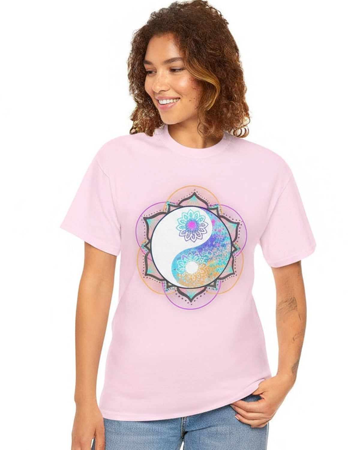Woman wearing a pink t-shirt with a colorful floral yin yang mandala design on a white background