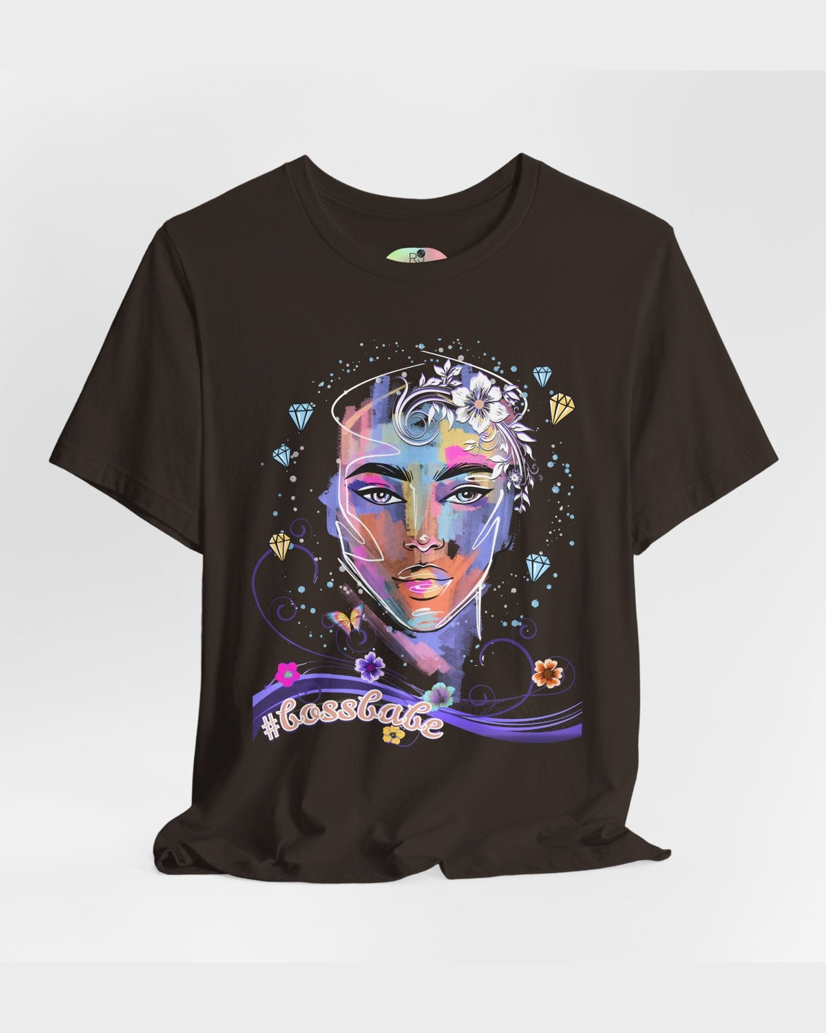 Brown t-shirt with a colorful graphic design of a female face, diamonds and flowers and a text #bossbabe on a white background