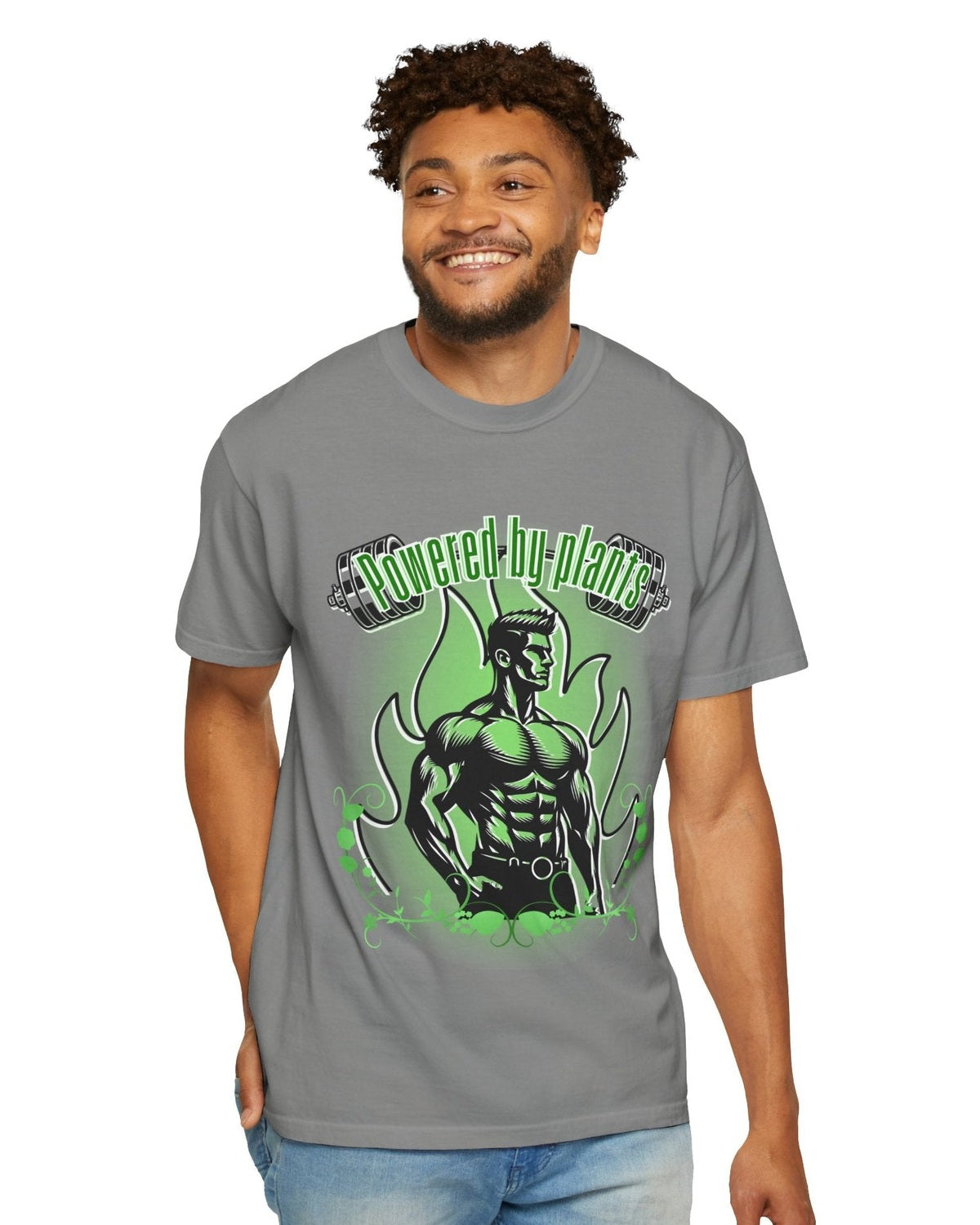 Man wearing a grey t-shirt with a green vegan muscle man graphic design and a text Powered by Plants on a white background