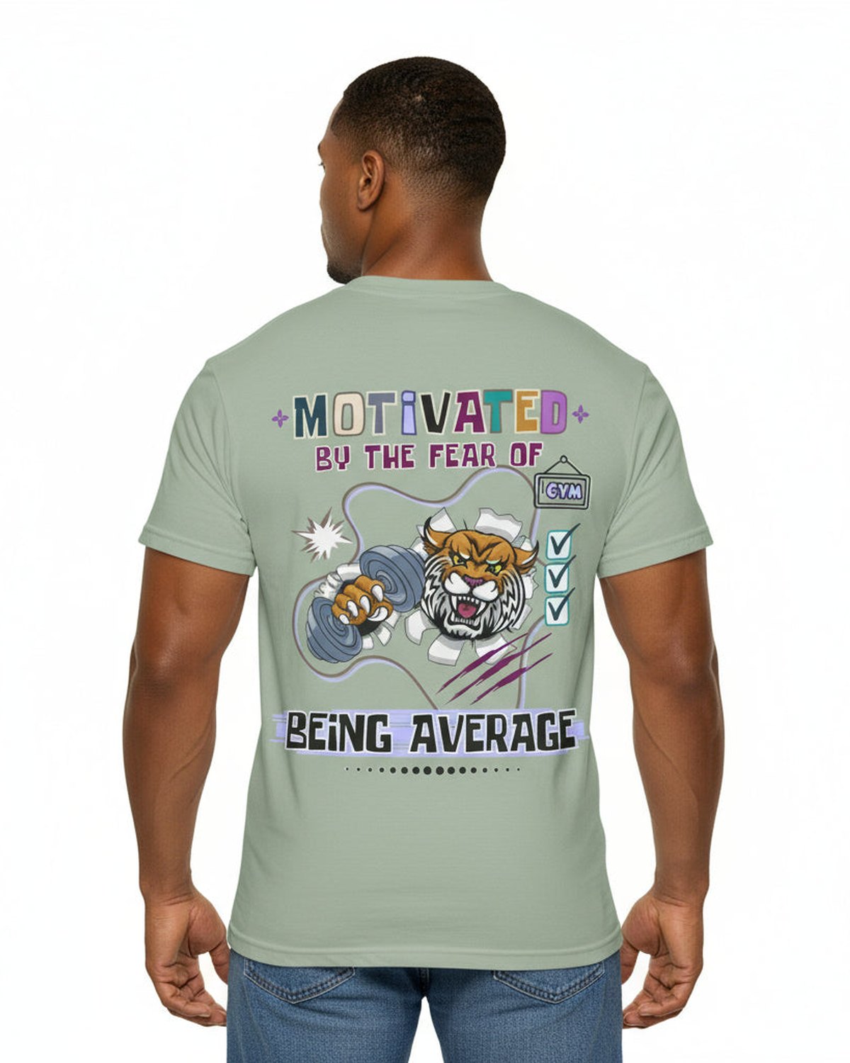 Person wearing a light green t-shirt with motivational text 'Motivated by the fear of being average' and fitness graphics on the back.