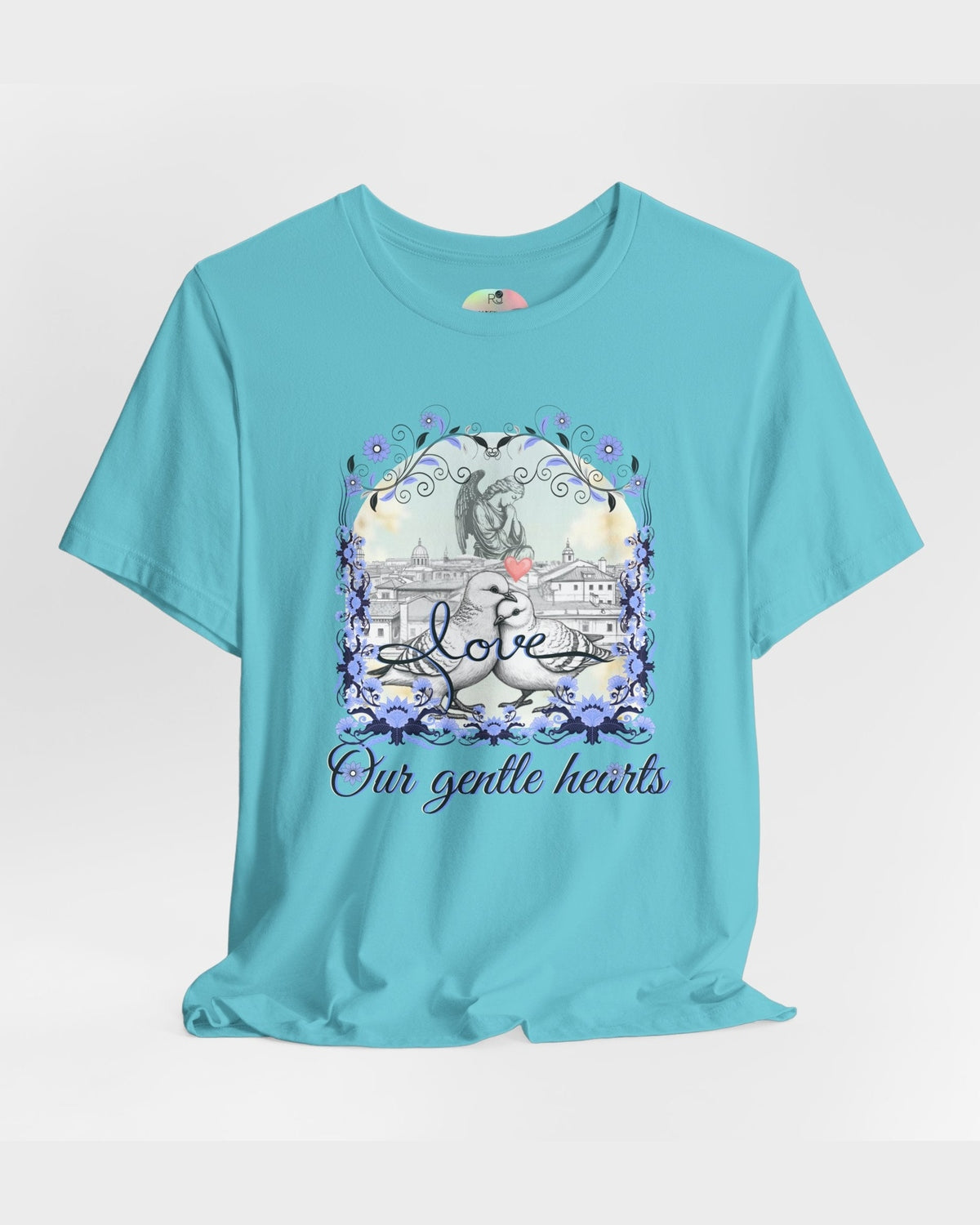 Turquoise t-shirt with a graphic pigeon design and text Love Our Gentle Hearts on a white background