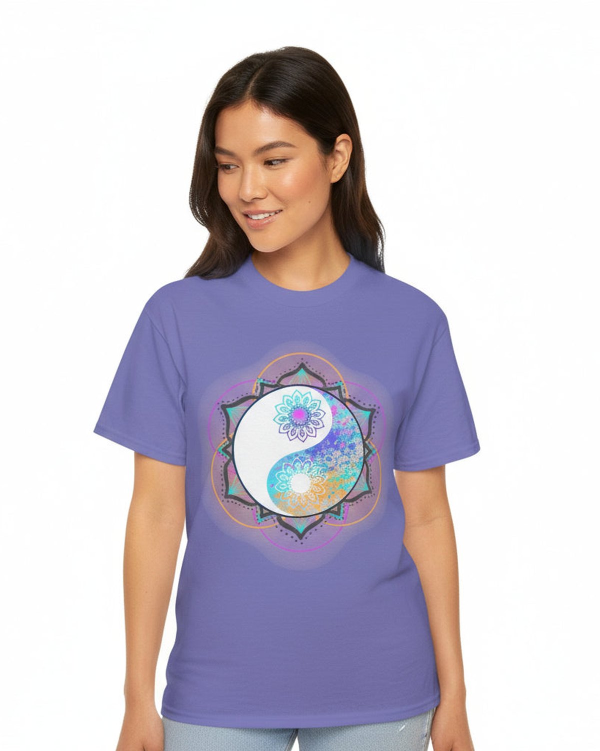 Woman wearing a purple t-shirt with a colorful floral yin yang mandala design, standing against a white background
