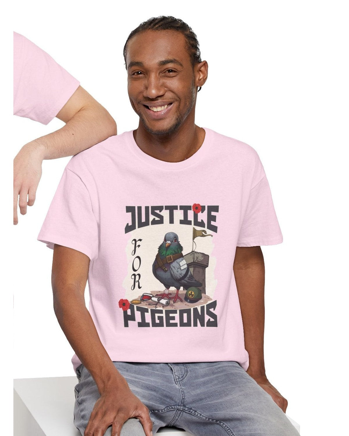 Man wearing a pink t-shirt with 'Justice for Pigeons' tribute graphic design.