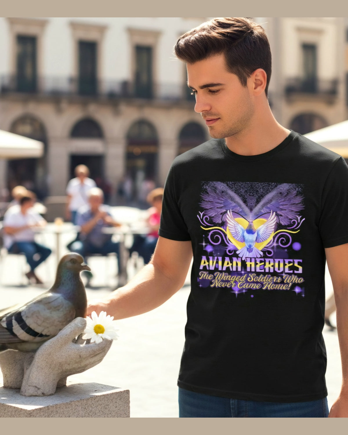 Man wearing a black tribute t-shirt with a pigeon graphic design and text Avian Heroes, standing outdoors.