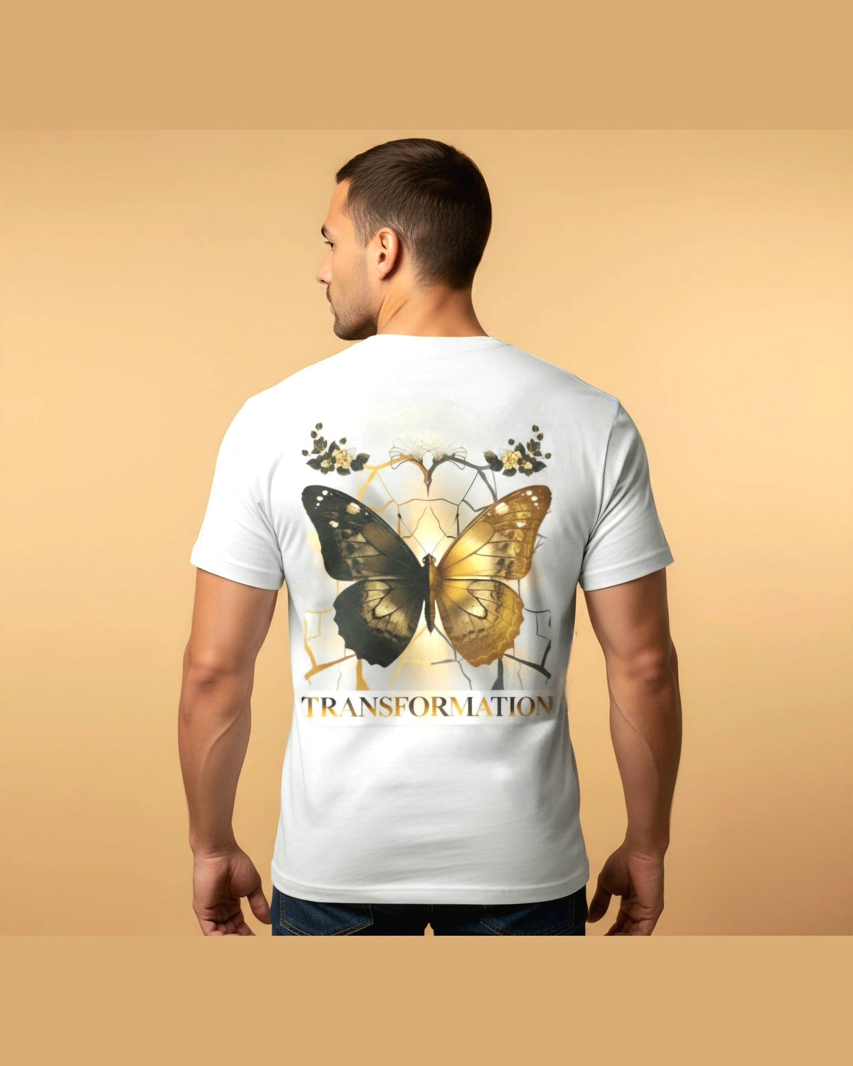 Man wearing a white t-shirt with a butterfly design and 'TRANSFORMATION' text on the back against a beige background