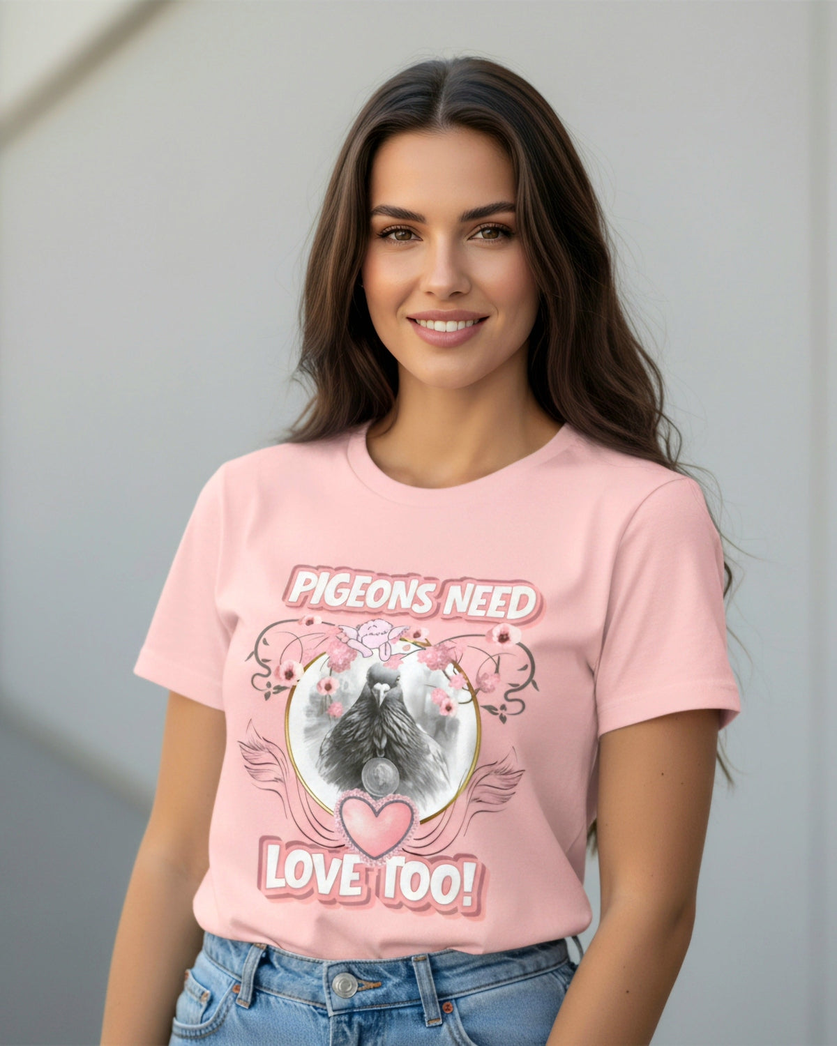 Woman wearing a pink t-shirt with a pigeon graphic and a text Pigeons need love toooutdoors.