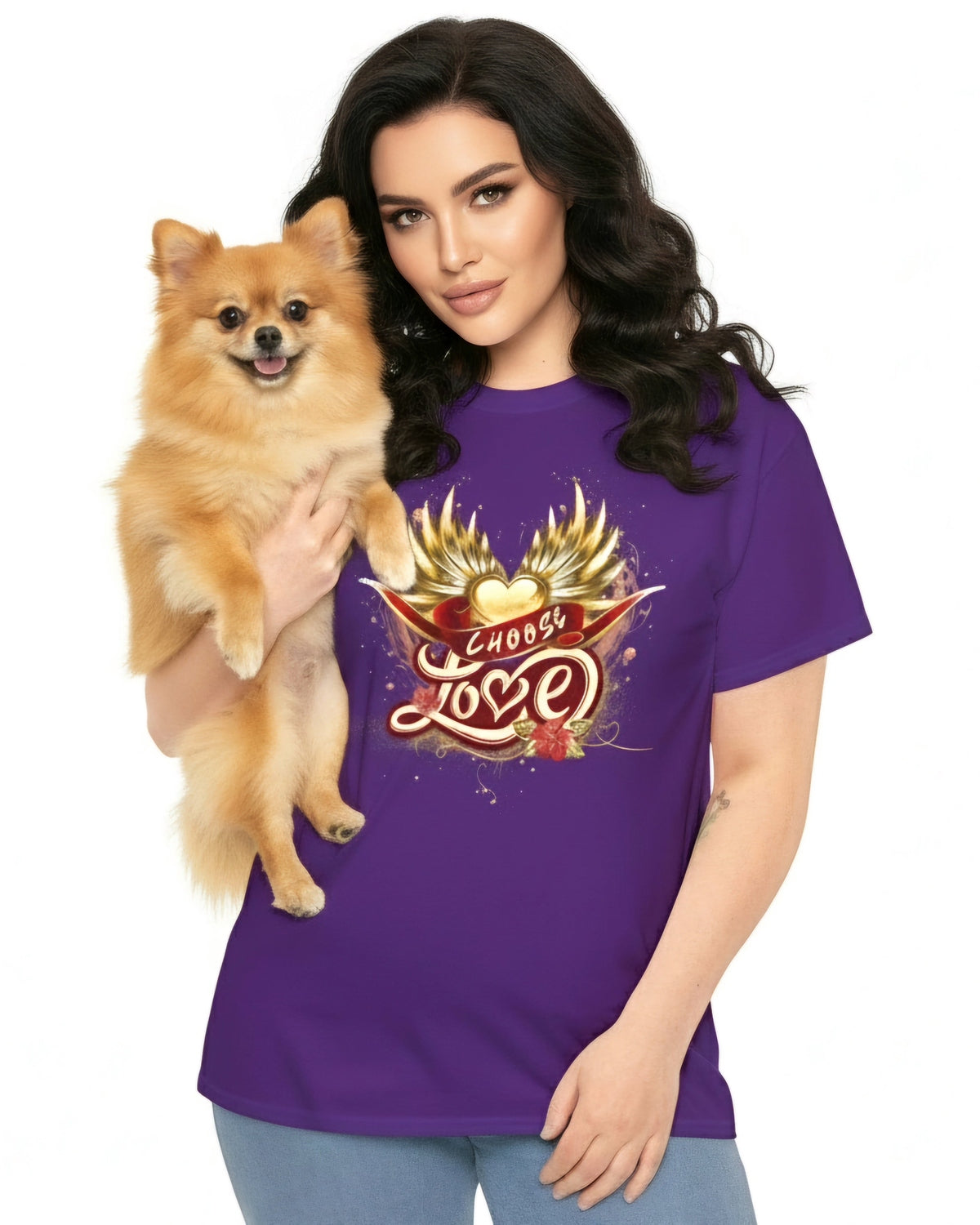 Woman wearing a purple t-shirt with golden wings and heart, red ribbon and 'Choose Love' design, holding a small brown dog.