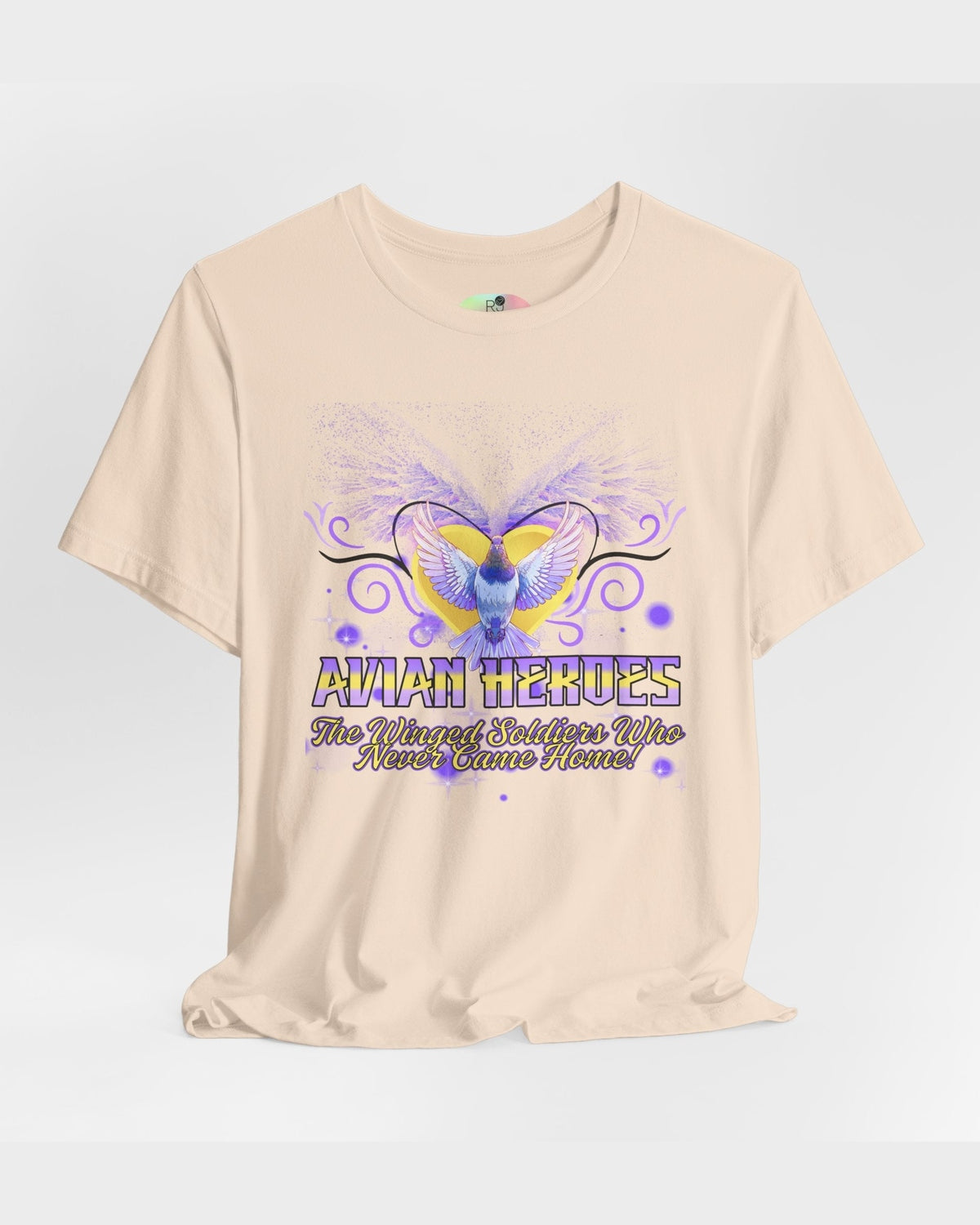 Beige t-shirt with pigeon and golden heart graphic and text Avian Heroes on a light gray background 